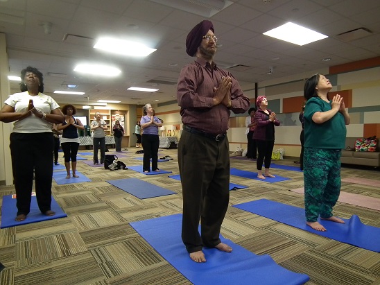 Image of several people doing yoga